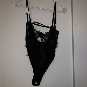 Lash sheer unlined black body suit.